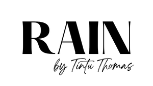 Black text 'RAIN by Tintu Thomas' on a white background
