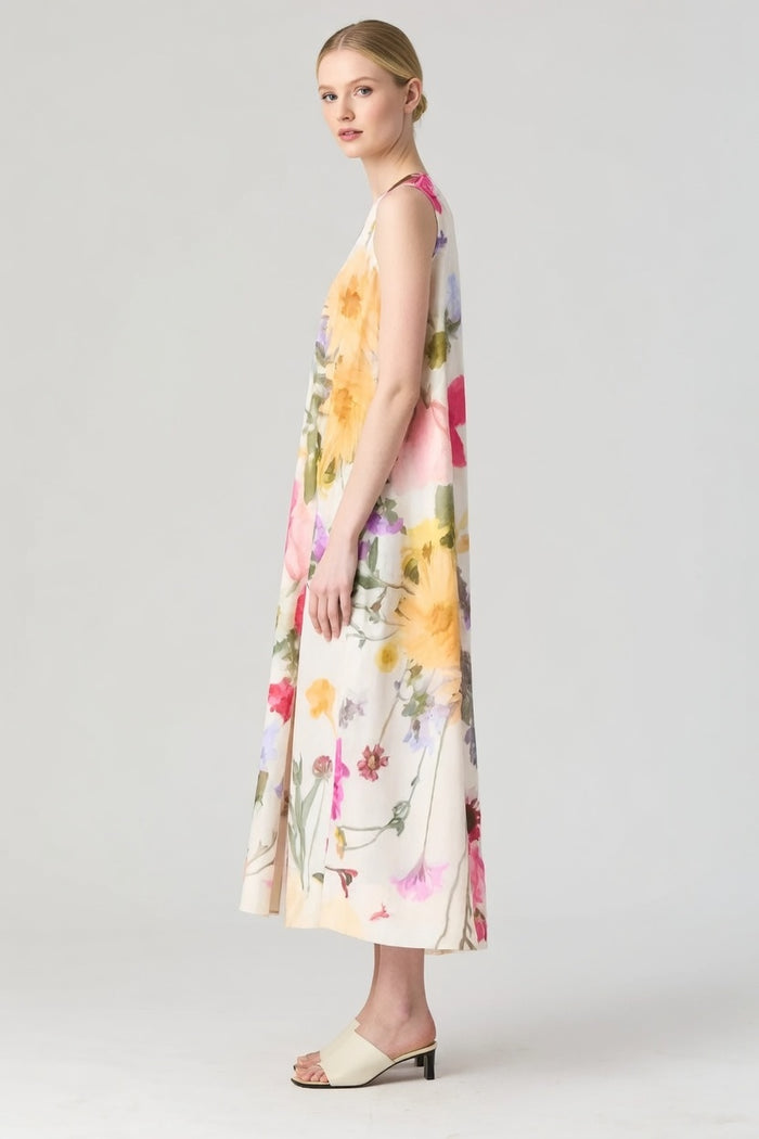 Maria Long Dress_Woman wearing a sleeveless floral midi dress 1