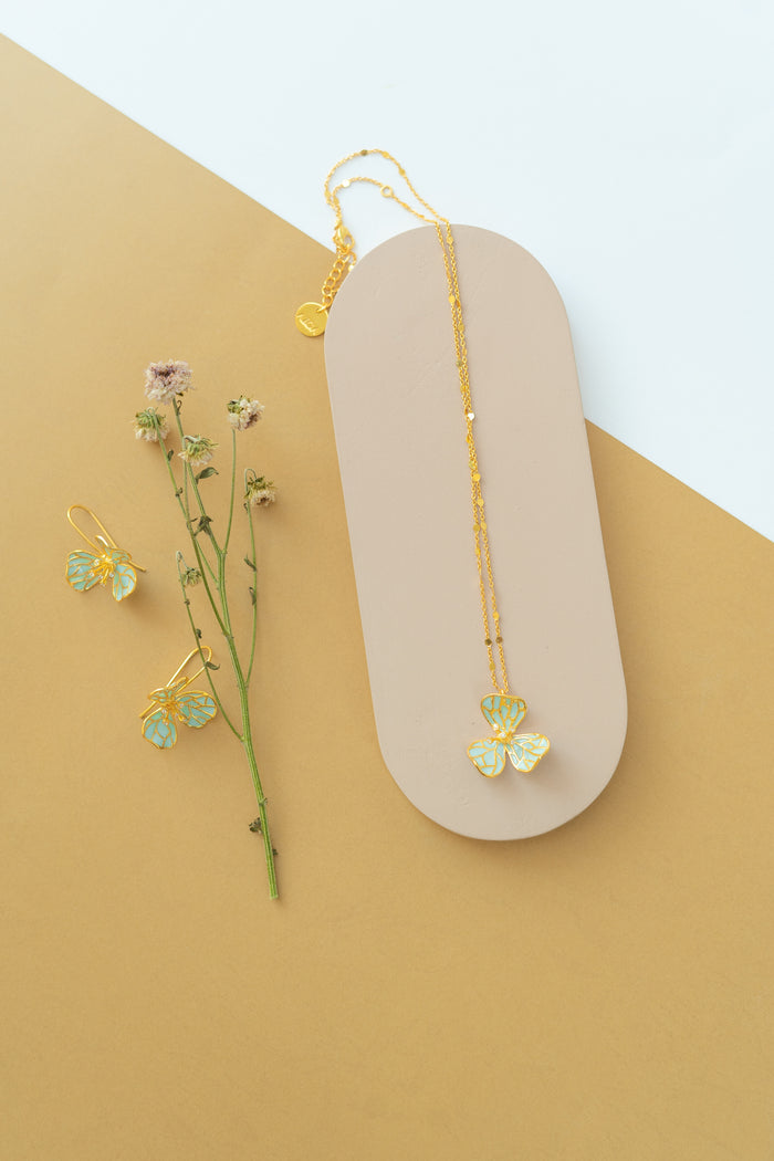 22k gold dipped necklace with a blue flower pendant_ picture of the set